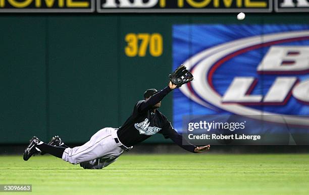 Center Juan Pierre of the Florida Marlins makes a catch on a ball hit by Mike Powell of the Los Angeles Angels of Anaheim in the fifth inning on June...