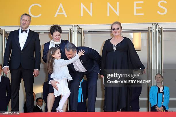Romanian director Cristi Puiu poses on May 12, 2016 with Romanian actor Mimi Branescu, Romanian producer Anca Puiu, Romanian actress Zoe Puiu and...