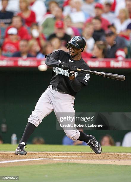 Center fielder Juan Pierre of the Florida Marlins swings at the ball during their game against the Los Angeles Angels of Anaheim on June 17, 2005 at...