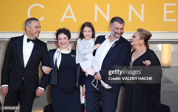 Romanian director Cristi Puiu poses on May 12, 2016 with Romanian actor Mimi Branescu, Romanian producer Anca Puiu, Romanian actress Zoe Puiu and...