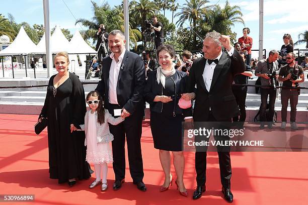 Romanian director Cristi Puiu poses on May 12, 2016 with Romanian actress Dana Dogaru, Romanian actress Zoe Puiu, Romanian producer Anca Puiu and...