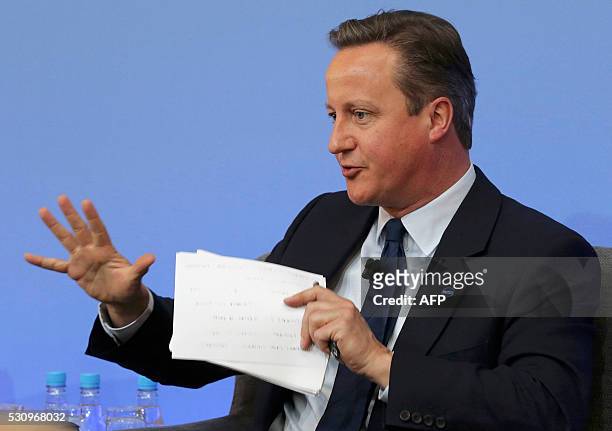 British Prime Minister David Cameron gestures as he participates in a panel discussion during the Anti-Corruption Summit London 2016, at Lancaster...