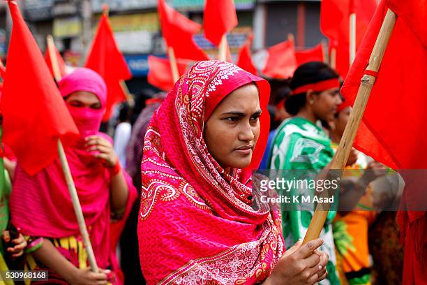 Bangladeshi garment workers attend a rally and shout slogans during a Labour Day protest in Dhaka, Bangladesh, May 01, 2016. Thousands of workers of...