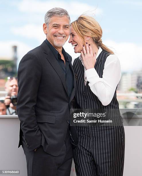George Clooney and Julia Roberts attend the "Money Monster" Photocall at the annual 69th Cannes Film Festival at Palais des Festivals on May 12, 2016...