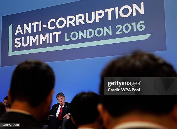 Colombia President Juan Manuel Santos sits on the podium during a panel discussion at the international anti-corruption summit on May 12, 2016 in...