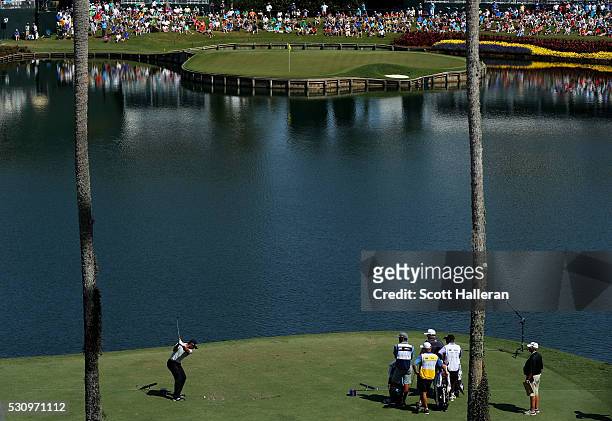 Jason Day of Australia plays his shot from the 17th tee during the first round of THE PLAYERS Championship at the Stadium course at TPC Sawgrass on...