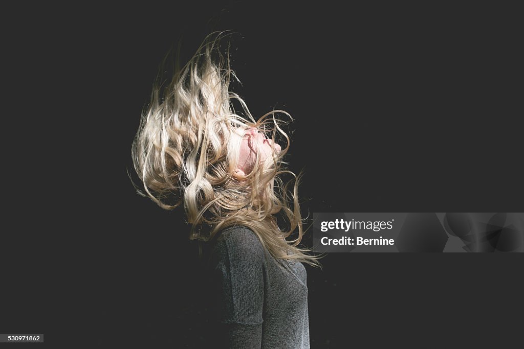 Blonde Female with Hair Over Face
