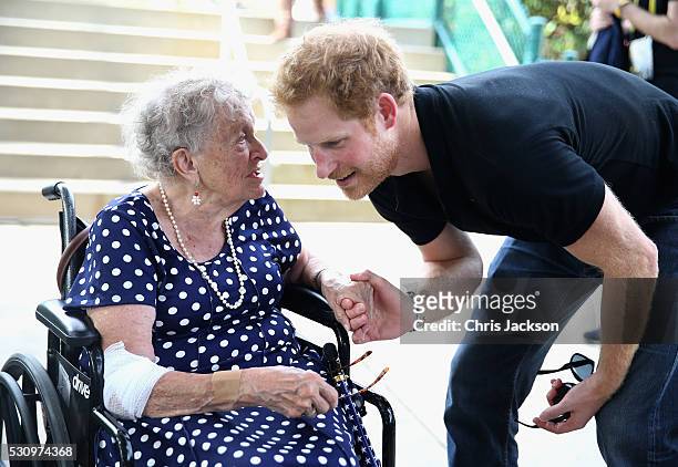 Prince Harry meets 95 year old Ruth Uffleman at the wheelchair tennis on the final day of the Invictus Games Orlando 2016 at ESPN Wide World of...