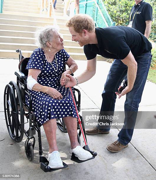 Prince Harry meets 95 year old Ruth Uffleman at the wheelchair tennis on the final day of the Invictus Games Orlando 2016 at ESPN Wide World of...