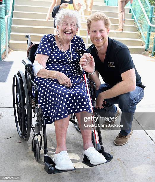 Prince Harry meets 95 year old Ruth Uffleman at the wheelchair tennis on the final day of the Invictus Games Orlando 2016 at ESPN Wide World of...