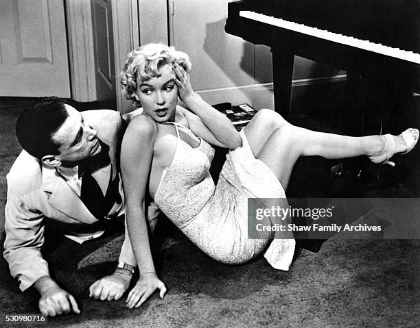 Marilyn Monroe with co-star Tom Ewell in 1954 during the filming of "The Seven Year Itch" in Los Angeles, California.