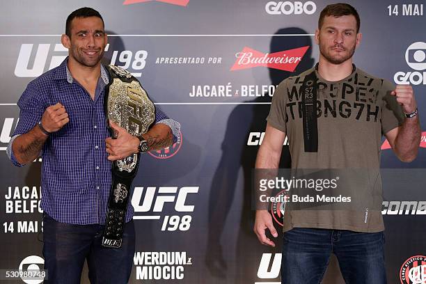 Heavyweight fighters Fabricio Werdum of Brazil and Stipe Miocic of the United States pose for photographers during Ultimate Media Day at Arena da...