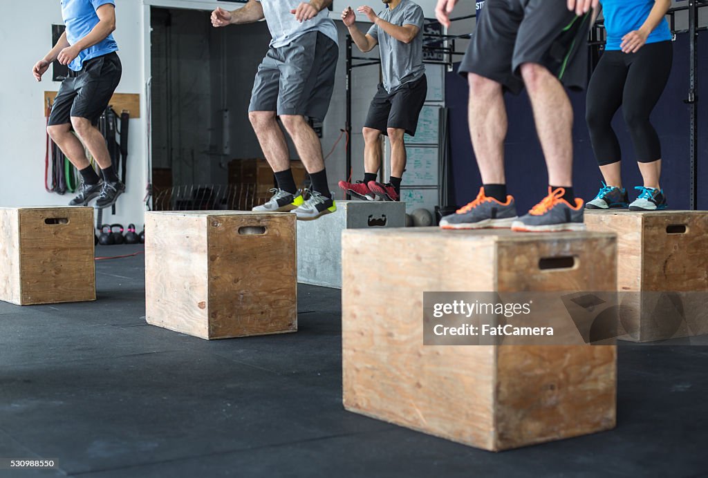 Group of people doing intense exercise and training