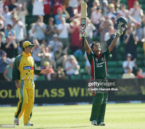 Mohammad Ashraful of Bangladesh celebrates his century with Ricky Ponting of Australia looking on during the NatWest Series One Day International...