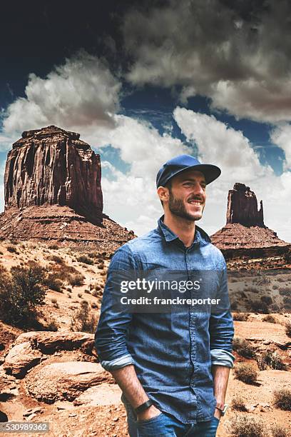 man discovery the monument valley national park - mesa arizona stock pictures, royalty-free photos & images