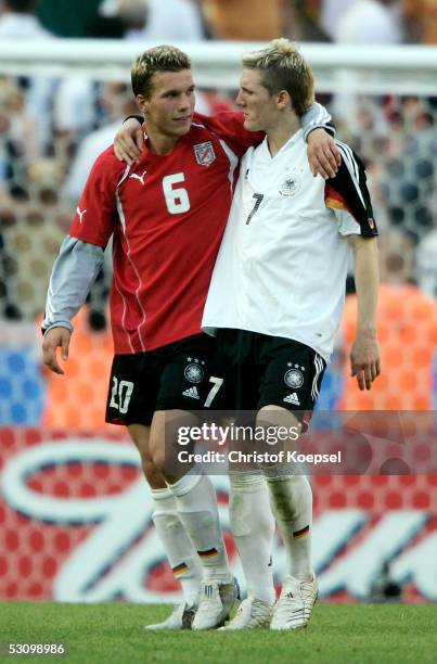 Lukas Podolski and Bastian Schweinsteiger celebrate the victory after the FIFA Confederations Cup match between Tunisia and Germany they won 3:0 on...