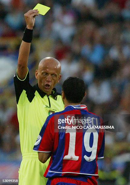 Italian referee Pierluigi Collina gives the yellow card to Bologna's player Marco Colucci during the football match Bologna vs Parma in the second...