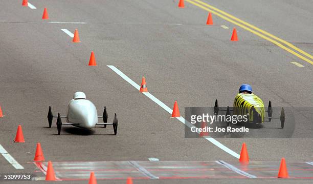 Robbie Reuss and Barry Kline race against each other in the 64th running of the Soap Box Derby from the top of Capitol Hill June 18, 2005 in...