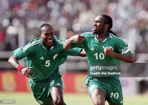 Jay Jay Okocha of Nigeria celebrates his goal with Chidi Odiah during the 2006 World Cup Qualifying match between Nigeria and Angola at the Sany...