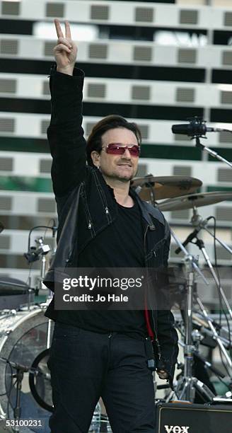Bono of U2 performs on stage on the first London night of their "Vertigo//2005" World Tour at Twickenham Rugby Stadium on June 18, 2005 in London,...