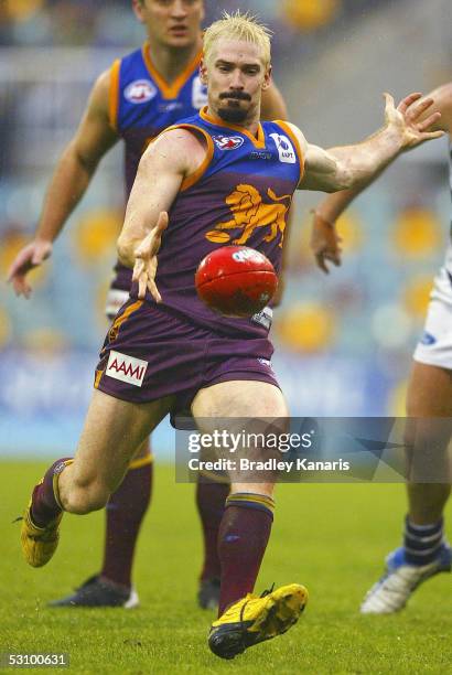 Jason Akermanis of the Lions in action during the round 13 AFL match between the Brisbane Lions and the Geelong Cats at the Gabba on June 19, 2005 in...