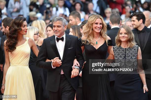 Director Jodie Foster arrives on May 12, 2016 with US actor George Clooney and his wife, British-Lebanese lawyer Amal Clooney and US actress Julia...