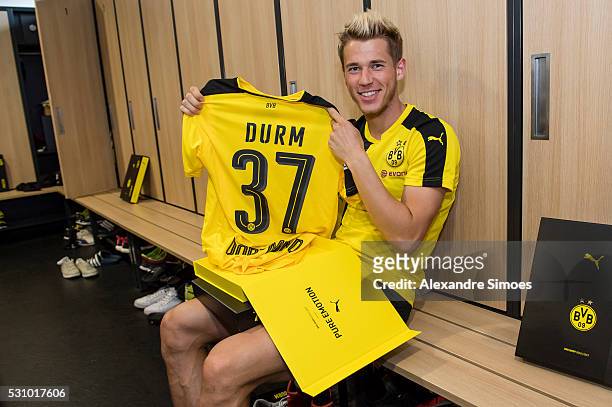 Erik Durm of Borussia Dortmund revealing the new Borussia Dortmund home jersey, Season 2016-2017 on May 12, 2016 in Dortmund, Germany.