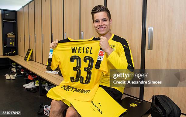 Julian Weigl of Borussia Dortmund revealing the new Borussia Dortmund home jersey, Season 2016-2017 on May 12, 2016 in Dortmund, Germany.