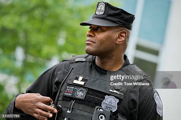 Member of the Metropolitan Police Department stands guard outside of the National Republican Senatorial Committee during a meeting between Republican...
