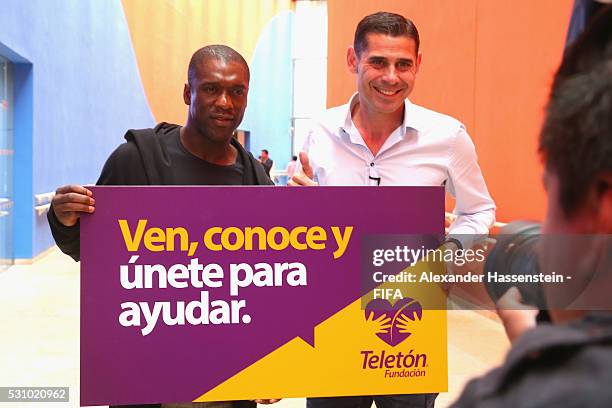 Clarence Seedorf and Fernado Hierro pose for the Teleton foundation as he and the FIFA Legends visit the Teleton foundation rehabilitation center at...