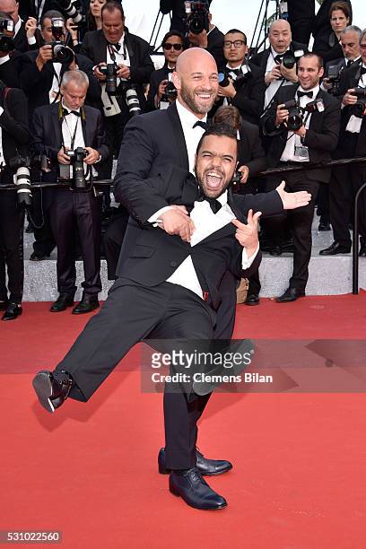 French actor Franck Gastambide and a guest attend the "Money Monster" premiere during the 69th annual Cannes Film Festival at the Palais des...