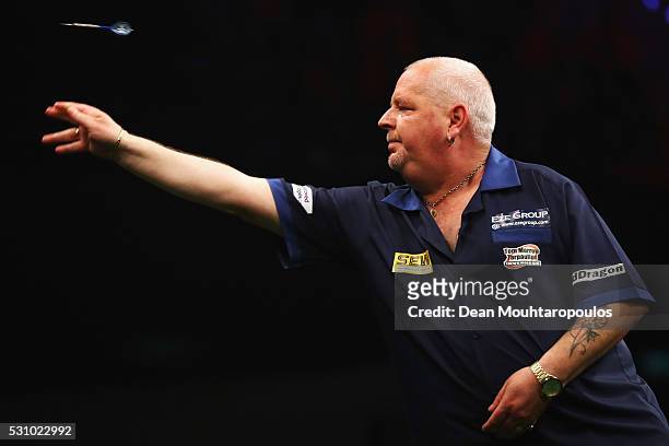 Robert Thornton of Scotland plays a shot in his match against James Wade of England during the Darts Betway Premier League Night 15 at Rotterdam Ahoy...