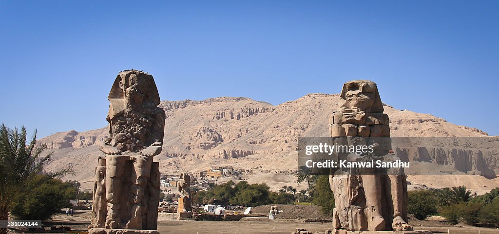 The Colossi of Memnon with the valley in background