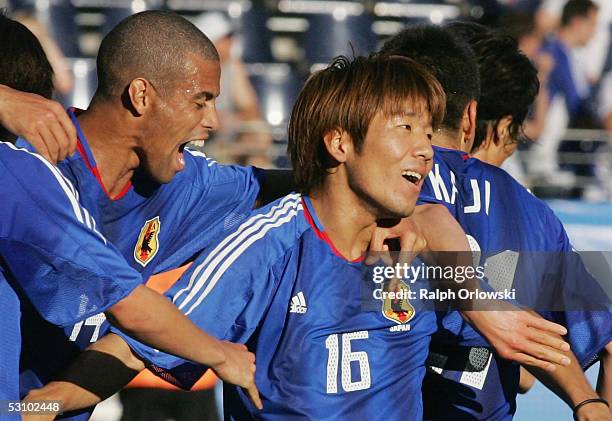 Shunsuke Nakamura is congratulated by Alessandro Santos after his goal during the match between Greece v Japan in the FIFA Confederations Cup 2005 at...