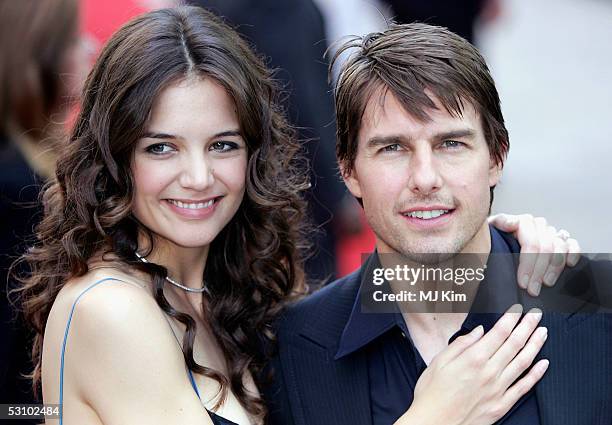 Actors Tom Cruise and fiancee Katie Holmes arrive for the UK Premiere of his new blockbuster "War Of The Worlds" at the Odeon Leicester Square on...