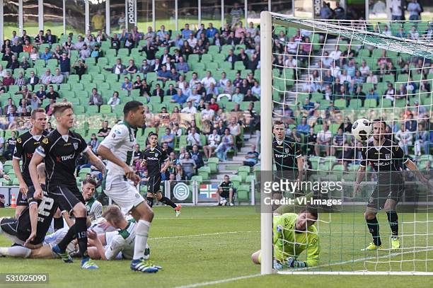 Fc Groningen - Heracles Almelo. Hedwiges Maduro of FC Groningen, Heracles Almelo doelman Bram Castro, during the Europa League Play-offs match...