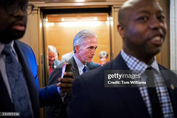 Rep. Trey Gowdy, R-S.C., center, and Sen. Tim Scott, R-S.C., right, make their way to the Senate floor during a vote, May 12, 2016. Gowdy was on the...