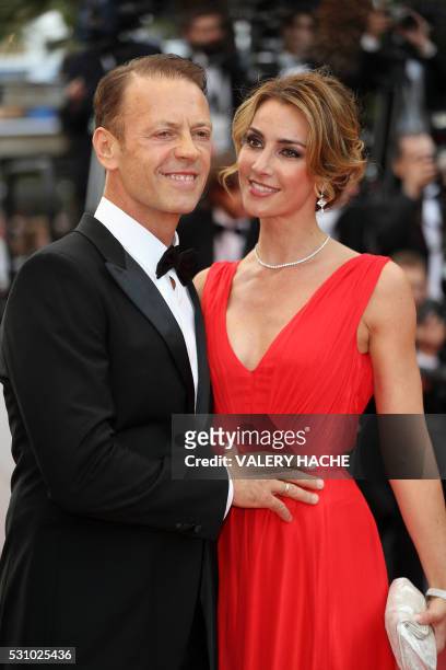Actor, director and producer Rocco Siffredi and his wife, Rosa Caracciolo pose on May 12, 2016 as they arrive for the screening of the film "Money...