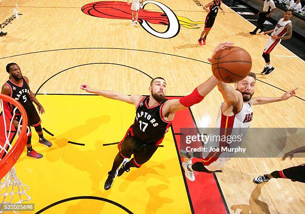 Jonas Valanciunas of the Toronto Raptors grabs the rebound against Josh McRoberts of the Miami Heat in Game Four of the Eastern Conference Semifinals...