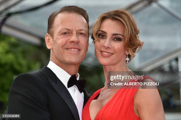 Italian pornographic actor Rocco Siffredi and his wife Rosa Caracciolo pose on May 12, 2016 as they arrive for the screening of the film "Money...