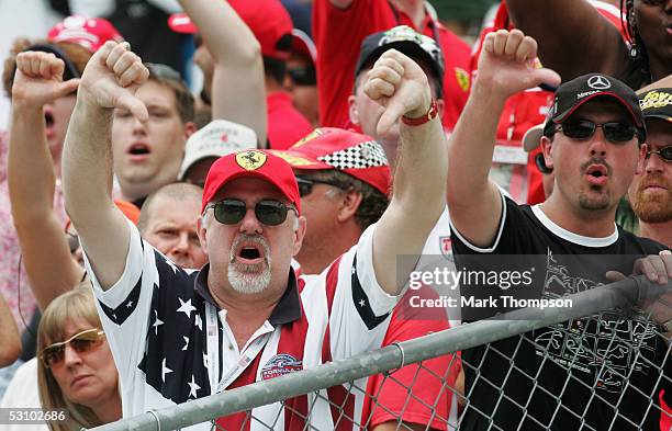 Fans show their disgust after all the cars on Michelin tires retired on lap one during the United States F1 Grand Prix at the Indianapolis Motor...