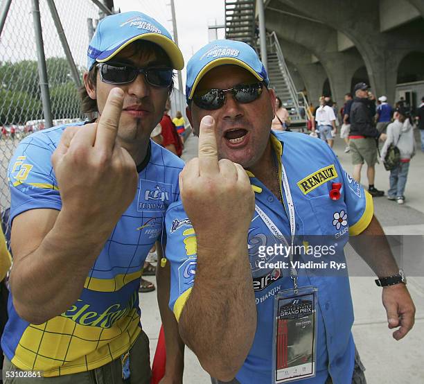 Fans of Renault show their emotions before leaving the speedway during the US F1 Grand Prix on June 19, 2005 in Indianapolis, Indiana. Only six...