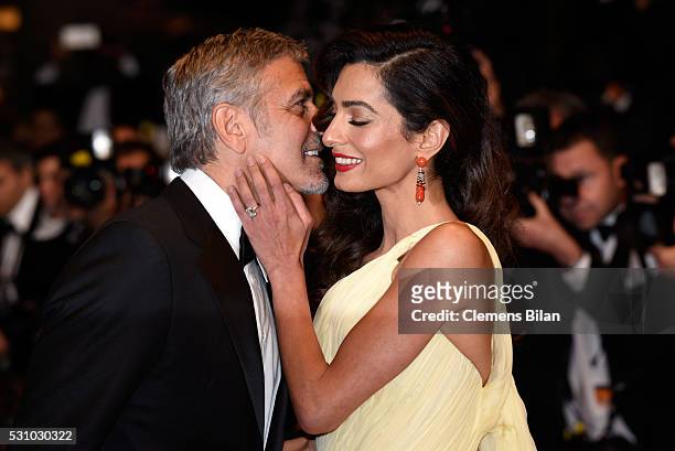 Actor George Clooney and his wife Amal Clooney attend the "Money Monster" premiere during the 69th annual Cannes Film Festival at the Palais des...