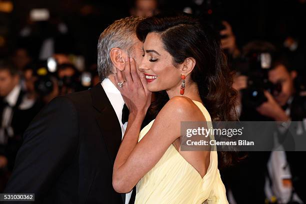 Actor George Clooney and his wife Amal Clooney attend the "Money Monster" premiere during the 69th annual Cannes Film Festival at the Palais des...