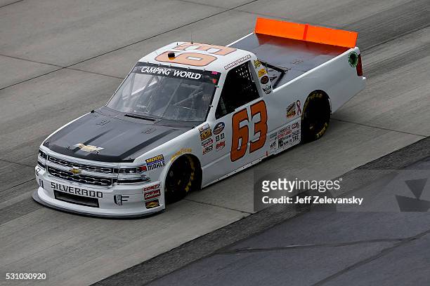 Bobby Pierce, driver of the Chevrolet, practices for the NASCAR Camping World Truck Series at Dover International Speedway on May 12, 2016 in Dover,...