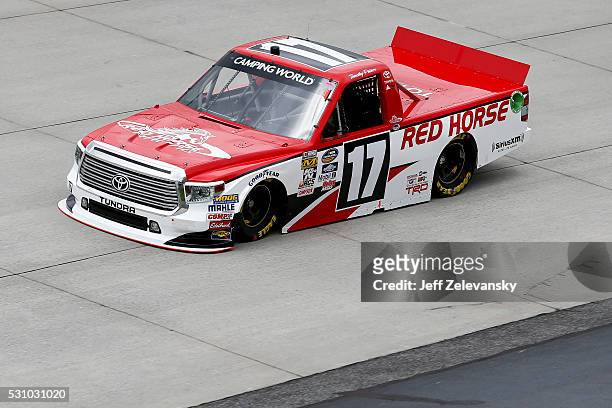 Timothy Peters, driver of the Red Horse Racing Toyota, practices for the NASCAR Camping World Truck Series at Dover International Speedway on May 12,...