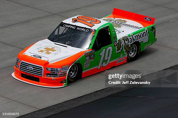 Daniel Hemric, driver of the Oakmont Management Group Ford, practices for the NASCAR Camping World Truck Series at Dover International Speedway on...