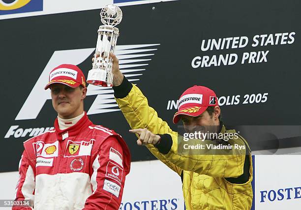 Tiago Monteiro of Portugal and Jordan celebrates his 3rd place finish while the winner Michael Schumacher of Germany and Ferrari looks on during the...