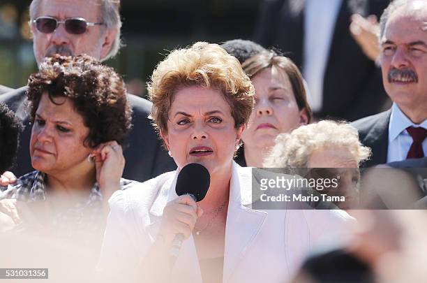Suspended Brazilian President Dilma Rousseff speaks to supporters at the Planalto presidential palace after the Senate voted to accept impeachment...