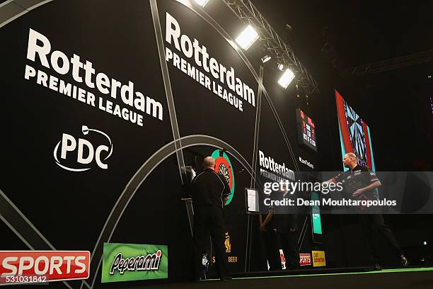 Raymond van Barneveld of the Netherlands plays a shot in his match against Peter Wright of Scotland during the Darts Betway Premier League Night 15...